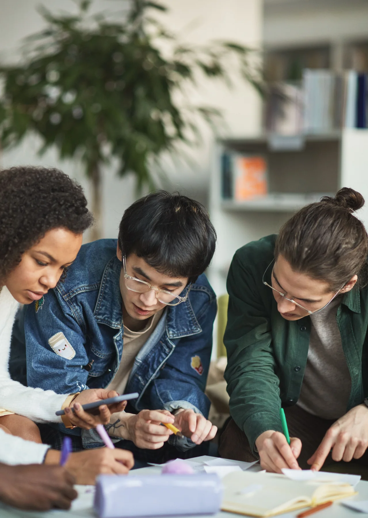 A diverse group of students working together in a professional learning environment